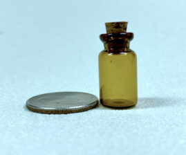 a miniature amber bottle